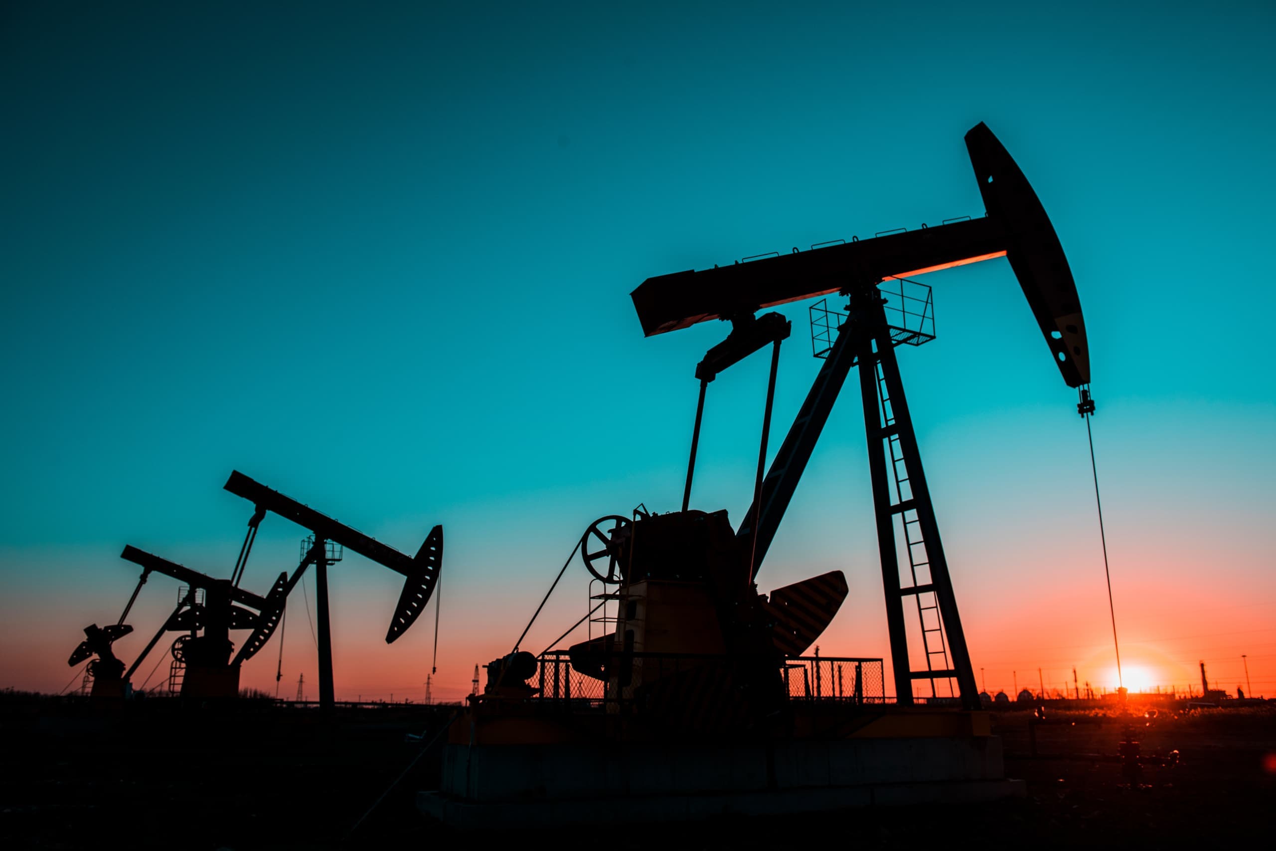 Rod-lift wells operating in the field at sunset